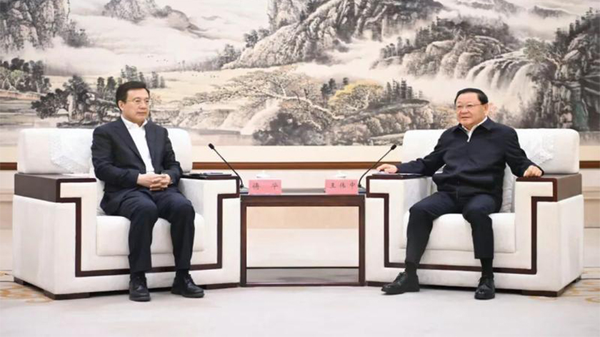 王伟中会见新华社社长傅华